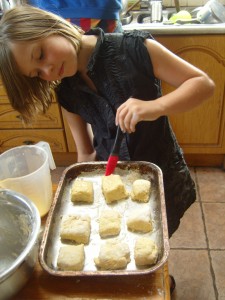 Athene brushing the scones with egg mixture